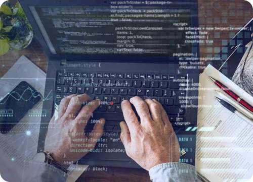 A Person Doing His Web Development Work On Computer Using Some Coding Languages.